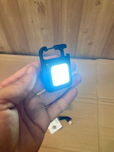 Compact and Powerful: COB Rechargeable Keychain Light.