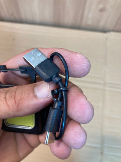 Compact and Powerful: COB Rechargeable Keychain Light.